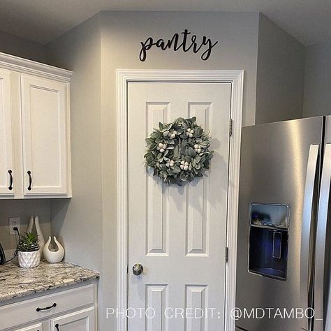 🌿I love this beautiful white kitchen with the greenery added in for a pop of color♥. This gorgeous kitchen is also showcasing our metal “PANTRY” sign. #pantry #pantrydecor #pantrydesign #kitchen #kitchendecor #whitekitchen #whitecabinets #metal #metaldecor #customerphotos #weloveourcustomers #home #homedecor #shoplocal #supportsmallbusinesses #supportlocalbusiness #shopsimplyinspiredco #simplyinspiredco Pantry Door Decor, Decor Above Kitchen Cabinets, Beautiful White Kitchens, Pantry Decor, Pantry Sign, Above Kitchen Cabinets, Modern Metal Wall Art, Kitchen Cabinets Decor, Wall Art Metal