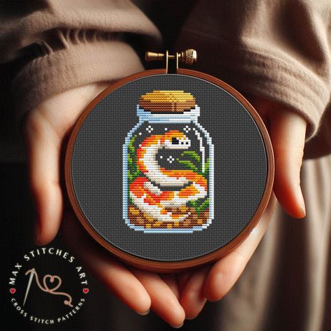 This is a ready-made PDF pattern for cross-stitching, which you will receive immediately after payment confirmation. You will be able to instantly download the pattern and start cross-stitching;) Fabric: 14 count Black Aida Stitches: 39 x 61 Size: 2.79 x 4.36inches or 7.08 x 11.07cm Use 2 strands of thread for cross stitch Colours: DMC (15 colors) This is a digital purchase that you instantly upload to your email. A physical item is not sent to you. In this regard, we do not make a refund. If yo Cottagecore Cross Stitch Pattern, Tiny Cross Stitch Patterns, Gaming Cross Stitch, Cross Stitch Tiny, Jar Cross Stitch, Black Cross Stitch, Snake Embroidery, Geeky Cross Stitch Patterns, Pattern Snake