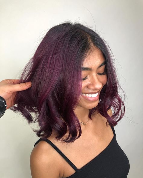 Plum Hair On Tan Skin, Purple Hair Streaks Black Hair, Violet Streaks In Black Hair, Short Eggplant Hair, Dark Plum Highlights On Dark Hair, Deep Plum Balayage, Wine Peekaboo Hair, Plum Purple Balayage, Hair Colour Purple Dark