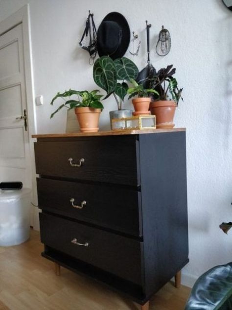 a black IKEA Malm dresser with refined metal handles and a light stained wooden top is a stylish mid century modern idea Ikea Upcycled Furniture, Upcycling Ikea Furniture, Upcycle Ikea Drawers, Upcycled Ikea Drawers, Upcycle Malm Drawers, Upcycle Ikea Furniture, Ikea Malm Upcycle, Ikea Dresser Makeover Malm, Ikea Malm Makeover