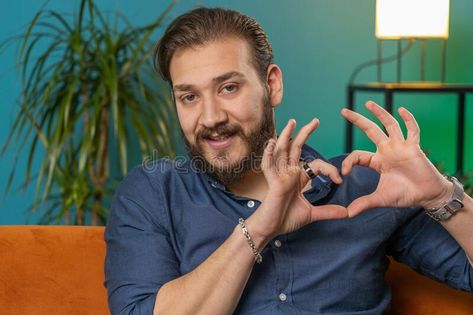 Happy lebanese man guy makes symbol of love showing heart sign to camera express romantic feelings royalty free stock image Charity Symbol, Picture Of A Man, Heart Image, Romantic Feelings, Men In Love, Love Sign, Man Standing, Heart Sign, Love Signs