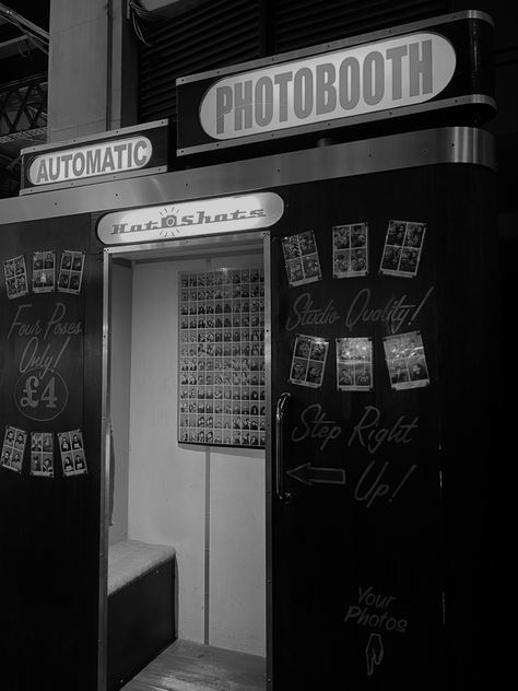 A black and white photo of a vintage photo booth, reminiscent of a romantic scene from a classic movie. The photo booth has an antique design, with a curtain drawn closed and a sign above that reads 'photobooth’ The photo captures a lifestyle dream quality.The photo has a timeless quality, adding to the romantic and nostalgic feel Black And White Photo Booth, 2000s Celebrities, Bday Vibes, 22nd Bday, Old Fashioned Photos, Tiny Desk, Vintage Photo Booths, London Living, Classic Romance