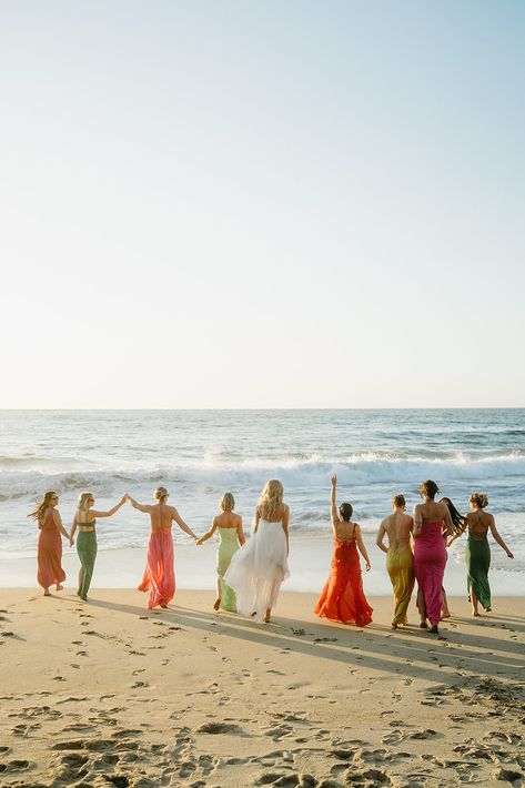 Gorgeous coastal wedding in Santa Barbara with the bride and her bridesmaids celebrating by the ocean. The bridesmaids’ colorful dresses bring a vibrant pop to the natural beach setting, perfect for a fun, relaxed California wedding vibe. Ideal inspiration for brides who love bold colors and a seaside ceremony. #SantaBarbaraWedding #BeachWedding #CoastalWedding #ColorfulBridesmaids #CaliforniaWedding #OceanViewCeremony Bridesmaid Beach Dresses, Bridesmaids Colorful, Colorful Bridesmaids, Beach Setting, Bride And Her Bridesmaids, Santa Barbara Beach, Beach Bridesmaids, Beach Bridesmaid Dresses, Santa Barbara Wedding