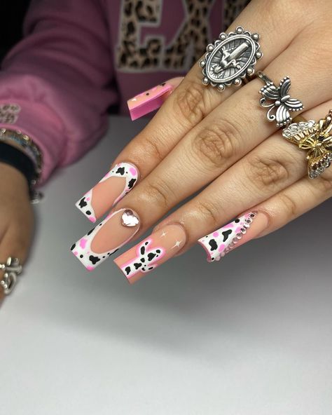 If you're a big fan of animal-inspired manicures, then pink cow print nails might be just what you need for your next nail design project! Includes beautiful pink nail polish designs for short nails, long nails, coffin nails, almond nails and many other options. Pink Vaquita Nails, Pink Cowgirl Nails Designs, Pink Cow Print Nails Acrylic, Hot Pink Cow Print Nails, Cow Print French Tip Nails, Short Cow Print Nails, Pink Cow Nails, Pink Nail Polish Designs, Print French Tip Nails