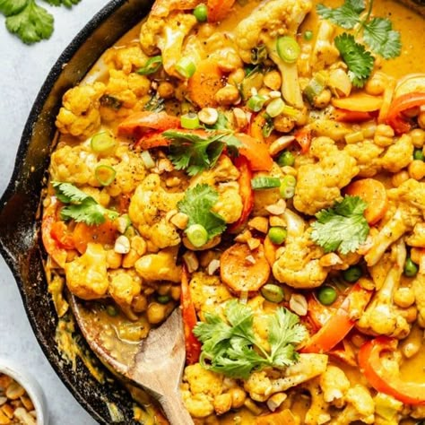 Beautiful Thai-inspired peanut coconut cauliflower chickpea curry packed with bold flavors, rainbow veggies, and plant-based protein. This cozy vegan chickpea curry is made in one pan in just 30 minutes for the perfect weekday meal! Cauliflower Chickpea Curry, Vegetarian Chickpea Curry, Ambitious Kitchen Recipes, Cauliflower And Chickpea Curry, Coconut Cauliflower, Quorn Recipes, Fun Dinner Ideas, Cauliflower Chickpea, Balanced Dinner Ideas