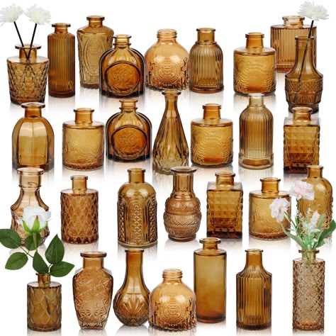 PRICES MAY VARY. Vintage Amber Bud Vases: There are 25 styles of our bud vases set. With exquisite embossed pattern, elegant and classic, our amber flower vases could be used for center table decoration, enhance the style of the interior space! Multi-purpose Amber Vases: Our small amber vases for centerpieces could be used for fresh flowers, silk flowers, dried flowers, greenery, branches, feathers, or other decorations, which will add a decorative charm to any room. Great Amber Glass Vase: Our Amber Bud Vases, Amber Vases, Center Table Decoration, Center Table Decor, Vases For Centerpieces, Folk Decor, Small Glass Vases, Glass Bud Vase, Thanksgiving Table Decorations