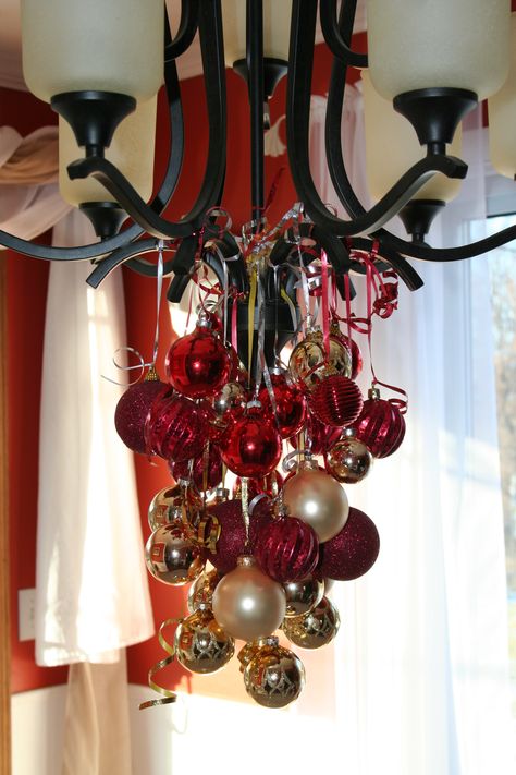 Christmas decorations-bulbs from chandelier Christmas Decor Ideas For Chandelier, Decorating A Chandelier For Christmas, Christmas Chandelier Decorations, Chandelier Christmas Decor, Chandelier Ornaments, Make A Chandelier, Christmas Chandeliers, Christmas Chandelier Decor, Christmas Chandelier