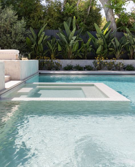 The stunning salt water pool at our #gsdxsantiagoparadise project features a modern infinity edge plunge spa, visually merging the two boundaries into one. Languid afternoons spent pool-side are just within reach, and boy does this scene have us feelin' ready to dive in!👙⁠ ⁠ _________________________⁠ ⁠ Project: #gsdxsantiagoparadise  ⁠ Landsape Build: @dig_landscapeconstruction⁠ Interior: @prairie_interiors ⁠ Photo: @rileystarrphoto Infinity Edge Spa In Pool, Modern Pool With Hot Tub, White Waterline Tile Pool, Infinity Pool Design Ideas, Rectangular Pool Landscaping, Pool Color Ideas, All White Pool, Pool Water Feature Wall, Modern Pool Ideas