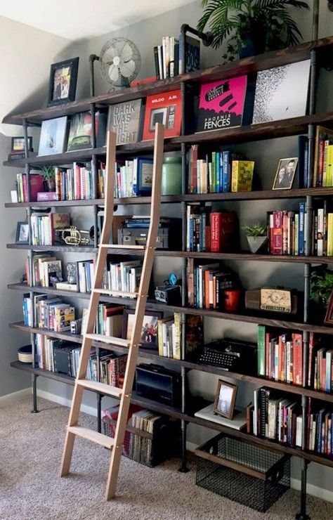 DIY Industrial Shelves on a #Budget   Think outside the box when it comes to updating spaces in your home that sit empty or get little attention. These large floor-to-ceiling #industrial shelves provide great storage as well as decor. Industrial Shelf Diy, Industrial Shelves, Floor To Ceiling Bookshelves, Ceiling Shelves, Industrial Shelving, Bookshelves Diy, Home Libraries, Study Rooms, Industrial House