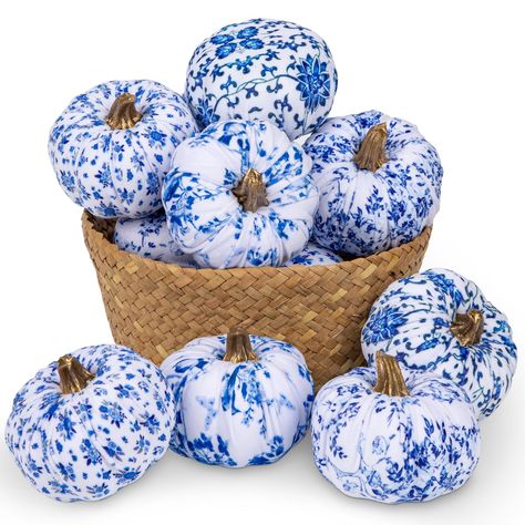 PRICES MAY VARY. Our blue and white fabric pumpkins are the perfect fall decorations. Available in sets of 3, 4, 6, and 8, these decorative pumpkins come in vibrant colors and various sizes, offering versatile uses. They will add a touch of elegant, warm and fresh inspiration to your fall décor. These artificial pumpkins are crafted from soft blue and white velvet fabric, filled with foam balls shaped like pumpkins, and topped with curled golden stems for a realistic look. The high-quality fabri Winter Pumpkin Decorations, Beach Fall Decor, Blue And White Thanksgiving, Blue And White Fall Decor, White Velvet Fabric, January Decor, Farmhouse Mantel, Decorative Pumpkins, Pumpkin Decorating Ideas