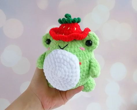 Size: Small 2.7" ( no paws) Medium 3.9" (no paws) Large 4.7" (with paws) Materials: Plush yarn, hypoallergenic hollow fiber   Please note that the package goes by the international route and delivery can take at least 10 business days. Frog Strawberry, Frog Stuffed Animal, Cute Froggy, Strawberry Frog, Stuffed Animal Crochet, Strawberry Hat, Frog Frog, Animal Crochet, Crochet Frog