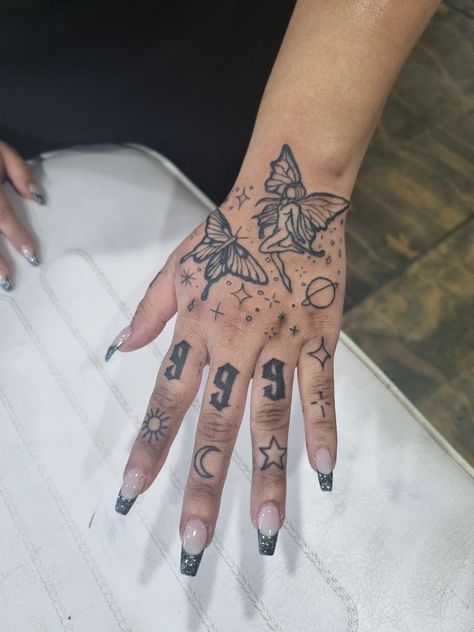 Butterfly Hand Tattoo With Sparkles, Spiritual Tattoos Hand, Fairy Hand Tattoo, Butterflies Hand Tattoo, Angel Number Hand Tattoo, Angel Tattoo On Hand, Hand Tats For Women, Butterfly Hand Tattoos, Star Hand Tattoos