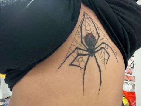 Chest Spider Tattoo Female, Spider Spine Tattoos For Women, Spider Tattoo With Number, Spider Ribcage Tattoo, Waist Tattoo Ideas Female, Maneater Tattoo Ideas, Black Widow Stomach Tattoo, Spider Web Back Tattoo, Spider Tattoo Sternum