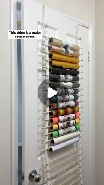 Megan Meketa • Crafting Tutorials on Instagram: "Let’s chat vinyl storage!! 📦💕 This is the craft room vinyl organizer from my friend Renee, @crafterscreek!! It can hold 25 rolls of vinyl and transfer tape and can be hung on the back of a door or on a wall. Major space saver!! It’s the perfect way for me to store my @teckwrapcraft vinyl rolls and transfer tape!! 👌✨ #craftstagram #happycrafting #ilovecrafting #lovecrafting #lovetocraft #craftlover #craftsupplies #craftingcommunity #craftstorage #craftingtools #crafttools #vinylstorage #craftroomorganization #smallcraftbusiness #craftroomstorage #cricut #heattransfervinyl #htvvinyl #teckwrapcraft" Ways To Store Cricut Vinyl, Vinyl Rolls Storage Ideas, Storage For Vinyl Rolls Diy, Diy Vinyl Roll Holder, How To Organize Vinyl Rolls, Circuit Vinyl Storage, Storing Cricut Vinyl Rolls, Ways To Store Vinyl Rolls, Storing Vinyl Rolls