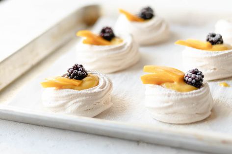 Mini Pavlovas with Lemon Mango Curd Mango Curd, Mini Pavlovas, Mini Pavlova, Pavlova Recipe, Yummy Deserts, Sensory Overload, Cake Board, Mini Desserts, Pavlova