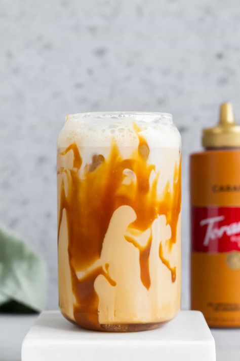 For a refreshing iced coffee, try this homemade iced caramel latte! It's sweet, creamy, and rich. All you need are four simple ingredients to make this coffee shop style iced coffee at home. Food Moodboard, Iced Caramel Latte, Iced Coffee At Home, Ice Milk, Caramel Latte, Coffee At Home, Vanilla Syrup, Decaf Coffee, Frothing Milk