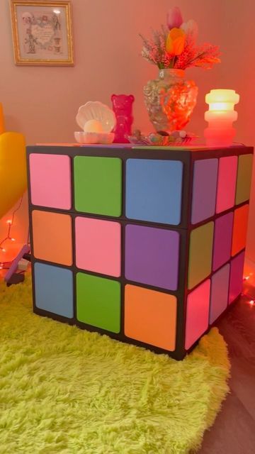 @jack.brickhouse on Instagram: "Here’s a fun commission I did for @berry.freshh ! A Rubik’s cube side table/storage chest cut out on the CNC. I like to think of it as a collab cause Olive painted the squares and shot the reel. More shots of the storage compartment coming 🌞 #furnituredesign #shapeoko #rubikscube #asheville #pastel #cheeseburgerinparadise #friendsdontlie #artfurniture #brickhouse #custom #rainbowaesthetic #queerfashion #colorfulhomedecor #handmade #cnc #kitsch #ashevillemaker #co Cube Bedside Table, Unusual Bedside Tables, Funky Coffee Tables, Cube Decor, Cube Coffee Table, Side Table Storage, Cube Furniture, Quirky Furniture, Cube Side Table