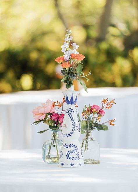 Tequila Bridal Shower Theme, Clase Azul Tequila Wedding, Clase Azul Flower Vase, Tequila Bottles Centerpieces, Casa Azul Tequila Theme Party, Tequila Centerpiece Ideas, Bottle Vases Wedding, August Baby Shower, Mexican Centerpiece