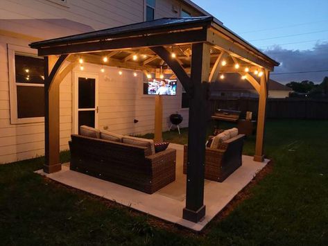 Check Out More Of These Inspiring Outdoor TV 📺 Setups - Yardistry Structures - Gazebos, Pavilions and Pergolas Tv In Outdoor Patio, Gazebo Next To House, Gazebo Tv Ideas, Patio Ideas With Tv, Outdoor Tv Ideas Patio Design, Outdoor Tv Area, Outdoor Tv Ideas, Outdoor Tv Setup, Outside Gazebo