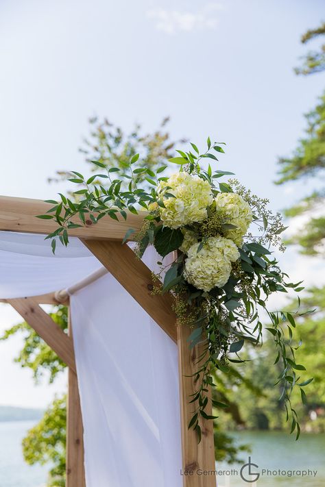 A simple ceremony arbor with accenting corner swags of white hydrangea, seeded eucalyptus and italian ruscus. Fall Wedding Arbor, Hydrangea Arrangements Wedding, Wedding Arbor Decorations, Ceremony Arbor, Wedding Arbor Rustic, Wedding Arbors, Wedding Swag, Wedding Arbor, Wedding Arch Rustic