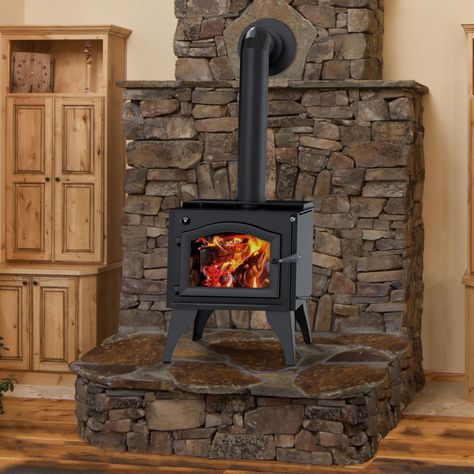 LE Wood Stoves, Freestanding LE Wood Stoves by Kuma Stoves Wood Stove Platform Ideas, Rock Hearth For Wood Stove, Freestanding Fireplace Wood Burning, Elevated Wood Stove, Stone Hearth For Wood Stove, Free Standing Wood Stove Ideas, Fisher Wood Stove, Wood Stove Ideas Living Rooms, Stone Behind Wood Stove