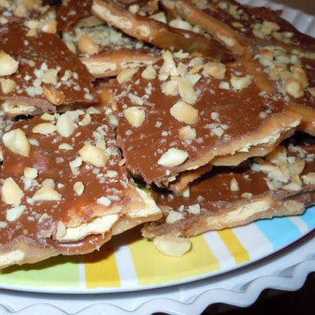 I have been making this for years and my friends have nicknamed crack....cuz it's so addicting!    Sweet and Saltines (Trisha Yearwood) Recipe | Key Ingredient Sweet And Saltines, Christmas Toffee, Trisha Yearwood Recipes, Club Crackers, Cracker Candy, Toffee Candy, Trisha Yearwood, Coconut Macaroons, God Mat