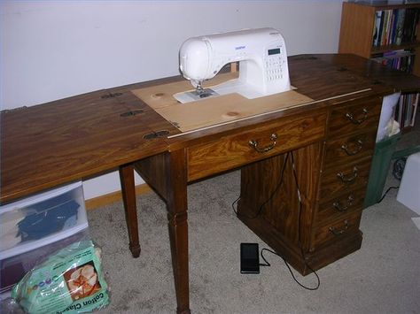 Need a sewing table for your new electronic sewing machine? Here is a cheap solution that works great. Purchase a sewing cabinet or table, old but sturdy, from a thrift store or garage sale and convert it to be used with your new sewing machine for under twenty bucks. This table works great for quilting! Old Sewing Cabinet, Sewing Table Repurpose, Sewing Machine Table Diy, Sewing Machines Best, Diy Sewing Table, Sewing Machine Tables, Sewing Machine Cabinet, Sewing Machine Table, Sewing Cabinet