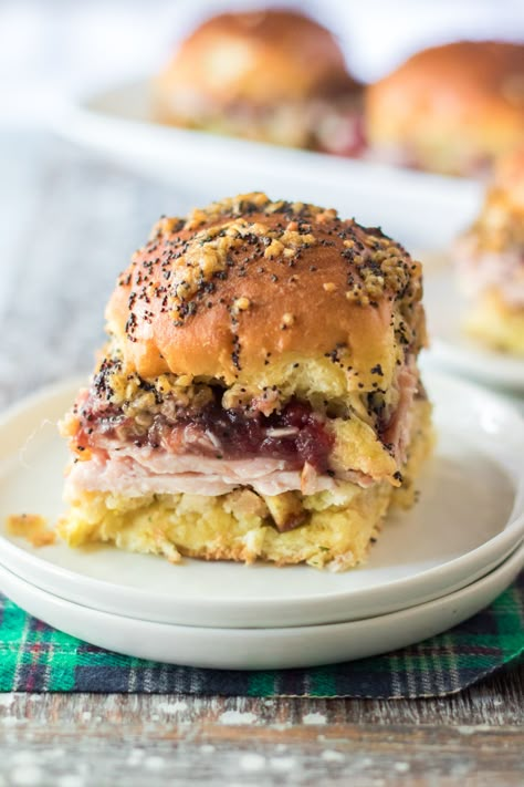 Deliciously creative, these Thanksgiving Sliders give leftovers of turkey, stuffing and cranberry sauce a place to land, sandwiched between sweet Hawaiian rolls and drizzled with a buttery and savory glaze, all baked to irresistible perfection. Thanksgiving Sliders, Thanksgiving Sandwich, Sour Cream Biscuits, Turkey Sliders, Rolled Sandwiches, Fluffy Dinner Rolls, Hawaiian Sweet Rolls, Turkey Stuffing, Mini Sandwiches