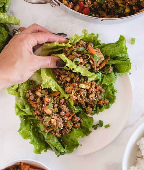 These quick-to-make ground beef lettuce wraps are loaded with savory ground beef and veggies doused in an umami-rich Asian-style soy ginger sauce! You can enjoy them with the beef filling nestled in crunchy lettuce as appetizers or snacks, or make them substantial enough for lunch or dinner by adding rice or grains. A fast ground beef dinner idea to add to you repertoire, the lettuce wraps come together in only 25 minutes, can be prepared ahead of time, and are easily made gluten free, too! Ground Beef Lettuce Wraps, Quick Pork Chop Recipes, Soy Ginger Sauce, Easy Lettuce Wraps, Lettuce Wraps Healthy, Lettuce Recipes, Ground Beef Dinner, Beef Wraps, Beef Lettuce Wraps