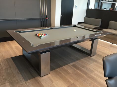 Modern Contemporary Pool Table Game room ideas  From exotic hardwoods to stainless steel we offer innovative hand crafted exquisite designs to fit your lifestyle. We welcome interior designers, architects and consumers alike to enjoy the finest and highest quality pool tables made.  Mitchell Pool Tables offer a unique collection of designs priced at the upper end of affordability. Billiard Table Design, Dining Room Pool Table, Pool Tables For Sale, Contemporary Pool, Pool Table Games, Custom Pool Tables, Modern Pool Table, Pool Table Dining Table, Pool Tables