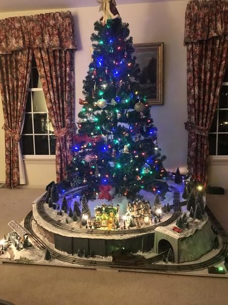 Christmas Train Set Display, Train Set Around Christmas Tree, Christmas Tree Train Platform, Christmas Train Under Tree, Christmas Train Around Tree, Christmas Village Display Under Tree, Train Around Christmas Tree Ideas, Christmas Tree With Train Around It, Christmas Tree Train Ideas