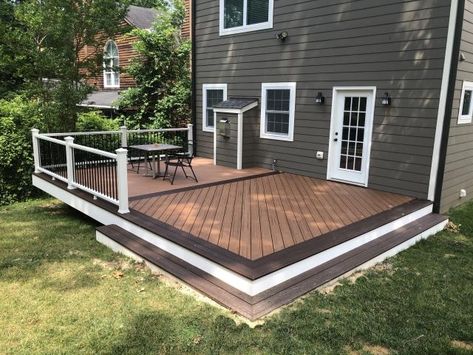 Arlington deck in Trex Transcends in Tiki Torch with Lava Rock border. Ground Level Trex Deck, Trex Deck With Pergola, Simple Back Deck Ideas, Deck Border Ideas, Trek Deck Ideas, Deck Patio Combo Ideas, Trex Deck Ideas Color Schemes, Deck Border, Ground Level Deck Ideas