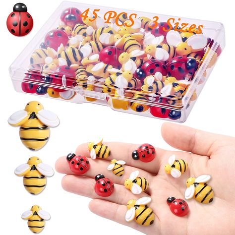 PRICES MAY VARY. ☃[Package] Package comes with 10 pieces 14mm/0.55inch, 10 pieces 19mm/0.75inch, 5 pieces 25mm/0.98inch tiny resin bees, 20 pieces 19mm/0.75inch tiny ladybugs, 45 pieces in total. The quantity of resin bees can meet all your need for DIY wreath, headband, hairpin, party decoration and so on. ☃[Easy to Use]You can easily stick them on the wall, picture frames, cards, buttons, mirror and anywhere you want to stick on.For some projects such as hats, clothes, headbands, you can add g Bee Themed Birthday Party, Bumble Bee Decorations, Birthday Party Table Decorations, Ladybug Decorations, Small Bees, Holiday Arrangement, Birthday Party Tables, Bee Crafts, Kraf Diy