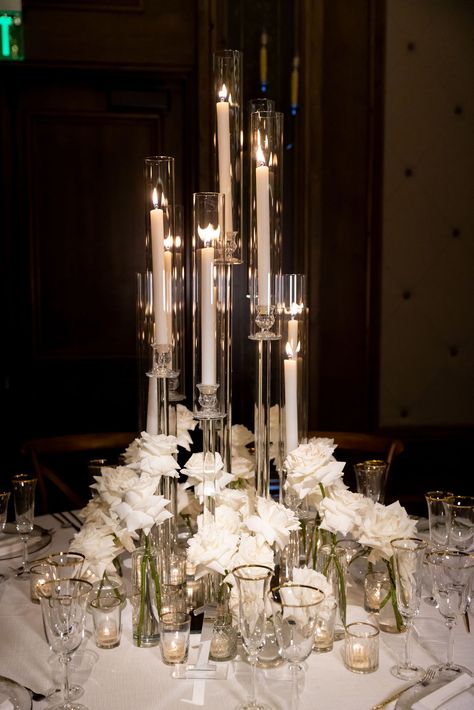 White rose budvases, tall glass modern candelabra Carnation Wedding Centerpieces, Candelabra Centerpiece Wedding, Round Table Centerpiece, Wedding Candelabra, Carnation Wedding, White Rose Wedding, Candelabra Wedding, Candelabra Centerpiece, White Roses Wedding