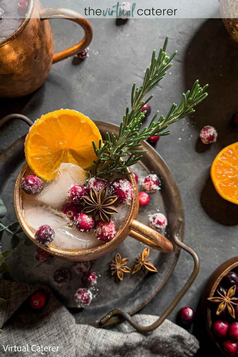 A Moscow Mule in a copper mug garnished with fresh rosemary, orange slices, and sugared cranberries. Thanksgiving Moscow Mule Recipe, Cranberry Moscow Mule Recipe, Winter Mocktails, Cranberry Mocktail, Cranberry Moscow Mule, Christmas Mocktails, Cranberry Thanksgiving, Baking Spices, Moscow Mule Cocktail