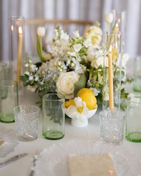 Drawing inspiration from the Amalfi Coast and coastal elegance, this stunning setup captures the essence of timeless beauty. The soft palette of whites and yellows, paired with delicate details like glassware and fresh lemons, transports you straight to an Italian seaside celebration. Every detail—from the lush floral arrangements to the graceful touches of candlelight—comes together to create a serene yet vibrant atmosphere. It’s a perfect balance of coastal charm and effortless sophisticati... Lemon Centerpiece Wedding, Spring Wedding Table, Italian Seaside, Lemon Centerpieces, Azalea Flower, Wedding Table Setting, Soft Palette, Coastal Elegance, Reception Dinner