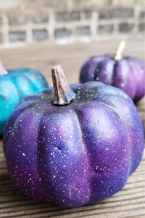 Purple Pumpkin Painting, Space Painted Pumpkin, Repunzle Pumpkin Painting, Purple Pumpkin Painting Ideas, Purple Painted Pumpkins, Purple Minion Pumpkin Painting, Glitter Pumpkins Diy, Pumpkin Designs Painted, Pumpkin Show