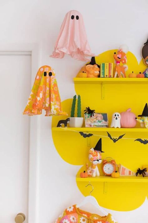 16 Groovy Halloween Decor Ideas » Lady Decluttered Fall Decor For Vendor Booth, Cheerful Halloween Decor, Elementary Halloween Decorations, Pastel Goth Wreath, Halloween Decor Colorful, Halloween Decorations Colorful, Affordable Fall Decor, Fall Diy Crafts Decoration, Seasonal Sewing Projects