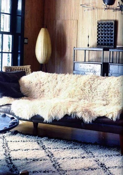 Cozy up your sofa by draping a sheepskin rug over it. Roman And Williams, Home Theaters, Sheepskin Throw, Vogue Living, Sheep Skin, Leather Couch, Sheepskin Rug, A Living Room, Baby Cold