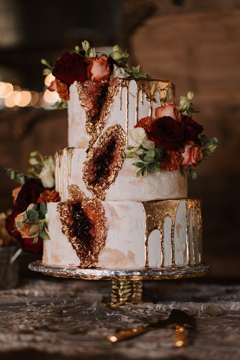 Beautiful geode cake by Krazy Cakes to play off of Amber and Marcus' terracotta wedding day theme! 📸@kenzieGalyeanphotography Geode Wedding Cakes, Red Geode Cake, Burgundy Geode Cake, Yellow Geode Cake, Geode Wedding Cake, Blue Geode Wedding Cake, Cave Wedding, Geode Cake Wedding, Geode Cake