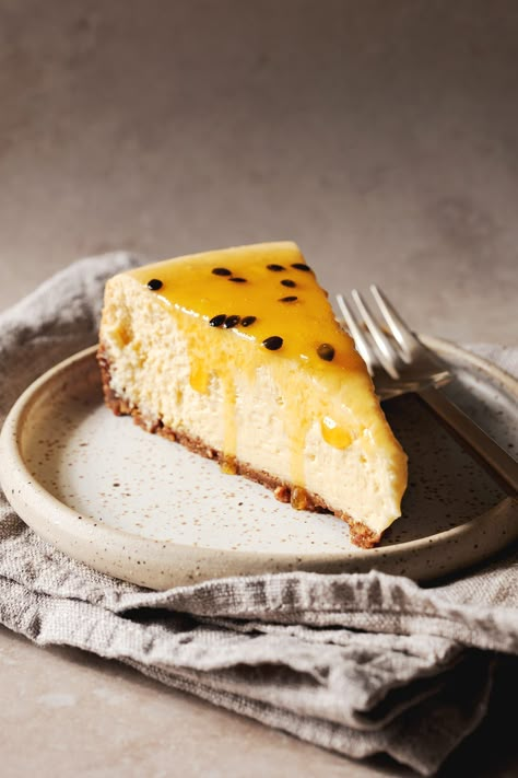 Super creamy baked passionfruit cheesecake with a spiced Lotus biscuit crust. It’s decadent and so insanely good! #passionfruit #cheesecake | teakandthyme.com Cheesecake Passion Fruit, Passion Fruit Photography, Cheesecake Basque, Passionfruit Cake, Biscoff Crust, Cheesecake Photography, Fruit Coulis, Passionfruit Cheesecake, Biscuit Crust