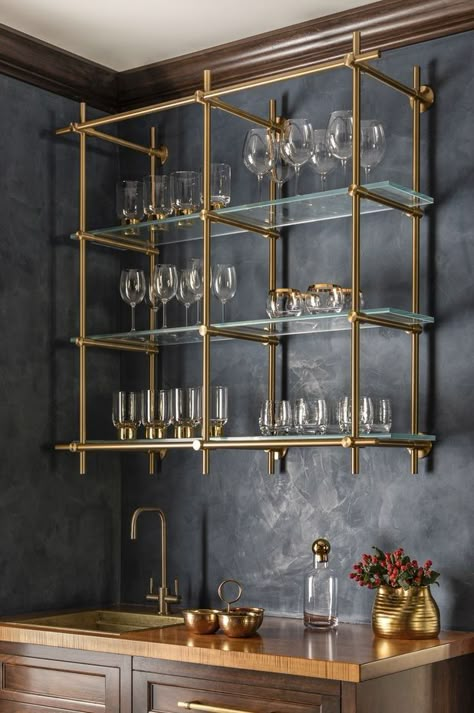 Gold Hanging Bar Shelves, Wallpaper Backsplash Bar, Bar With Wallpaper Backsplash, Unique Basement Bar Ideas, Brass Backsplash Kitchen, Bar Tile Backsplash, Bar Backsplash Ideas, Bar Niche, Cabin Style Kitchen