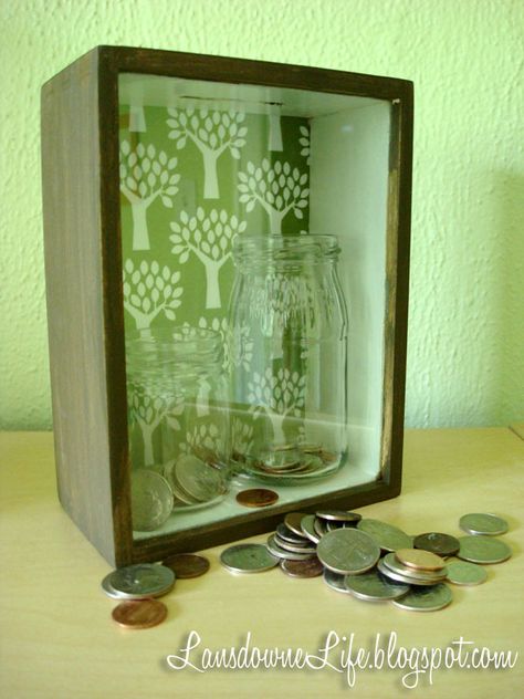 This idea was inspired by a few different things. 1) This idea to turn a shadowbox frame into a bank. 2) I remember some charity coin donation box on the counter of a Dairy Queen where the goal was to land a coin in a shot glass. Unimportant detail: it was also full of water. … Donation Box Ideas, Coin Jar, Diy Shadow Box, Student Christmas Gifts, Donation Box, Nonprofit Fundraising, Diy Valentines Crafts, Collection Box, Diy Valentines Gifts