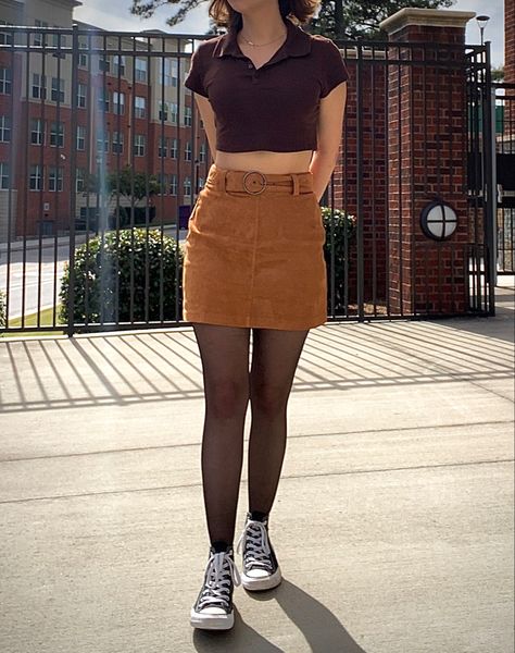 Fall Aesthetic outfit. Black converse with tights, orange-ish brown suede skirt with brown collared crop top. Black Top Brown Skirt, Brown Skirt With Black Tights, Brown Skirt Summer Outfit, Brown Courdory Skirt Outfits, Brown Courdory Skirt Outfit, Converse With Tights, Brown Skirt Outfit Aesthetic, Brown Corduroy Skirt Outfit, Brown Suede Skirt Outfit