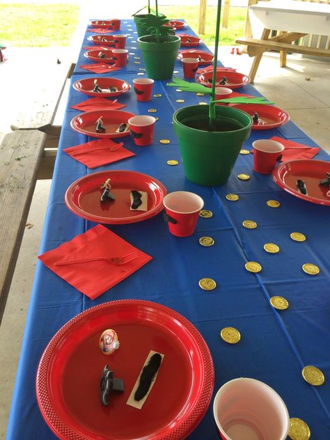 love.life.laughter. happily ever after...: mario birthday partry Mario And Luigi Birthday Party Table, Mario Birthday Table Set Up, Super Mario Party Table Decorations, Super Mario Bros Party Table Ideas, Mario Brothers Birthday Party Ideas Decoration, Mario Party Table Decor, Mario Birthday Party Table Decorations, Super Mario Table Set Up, Super Mario Birthday Table