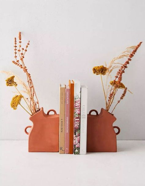 With these terracotta Vase Bookends, add florals to your bookshelves without compromising functionality. Available in a set of two. | Source: Urban Outfitters Cerámica Ideas, Keramik Design, Pottery Crafts, Pottery Classes, Ceramics Pottery Art, Ceramics Projects, Arte Inspo, Ceramics Ideas Pottery, Vase Design