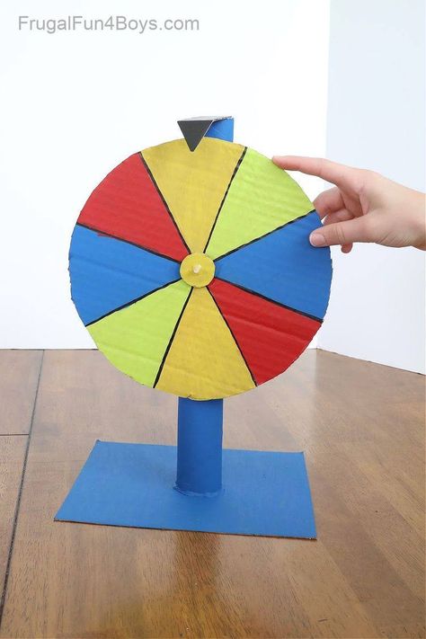 Cardboard Carnival Games, Cardboard Carnival, Diy Spinning Wheel, Paper Towel Crafts, Diy Kids Games, Toilet Paper Crafts, Stem Challenge, Candy Land Christmas Decorations Diy, Candy Land Christmas Decorations Outdoor