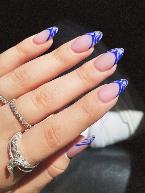 Blue Swirl French Tip Nails, Royal Blue Almond Nails Design, Almond Nails With Blue Swirls, Acrylic Nails Blue Swirls, Blue French Tips With Swirls, Blue And Purple Swirl Nails, Royal Blue Nails, Blue French Tips, Almond Nails Designs