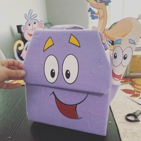 Super east to make! Just need two cereal boxes and purple felt Explorer Backpack, Cereal Boxes, Diy Backpack, Dora The Explorer, Cereal, Mario Characters, Cricut, Felt, Purple