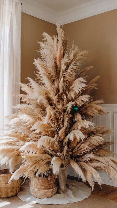 Bohemian-inspired pampas grass Christmas tree in a cozy, neutral-toned room Pampas Grass Tree, Non Traditional Christmas Tree, Creative Christmas Tree Ideas, Traditional Christmas Tree Ideas, Boho Christmas Tree, Grass Tree, Pretty Christmas Decorations, Pampas Grass Decor, Creative Christmas Trees